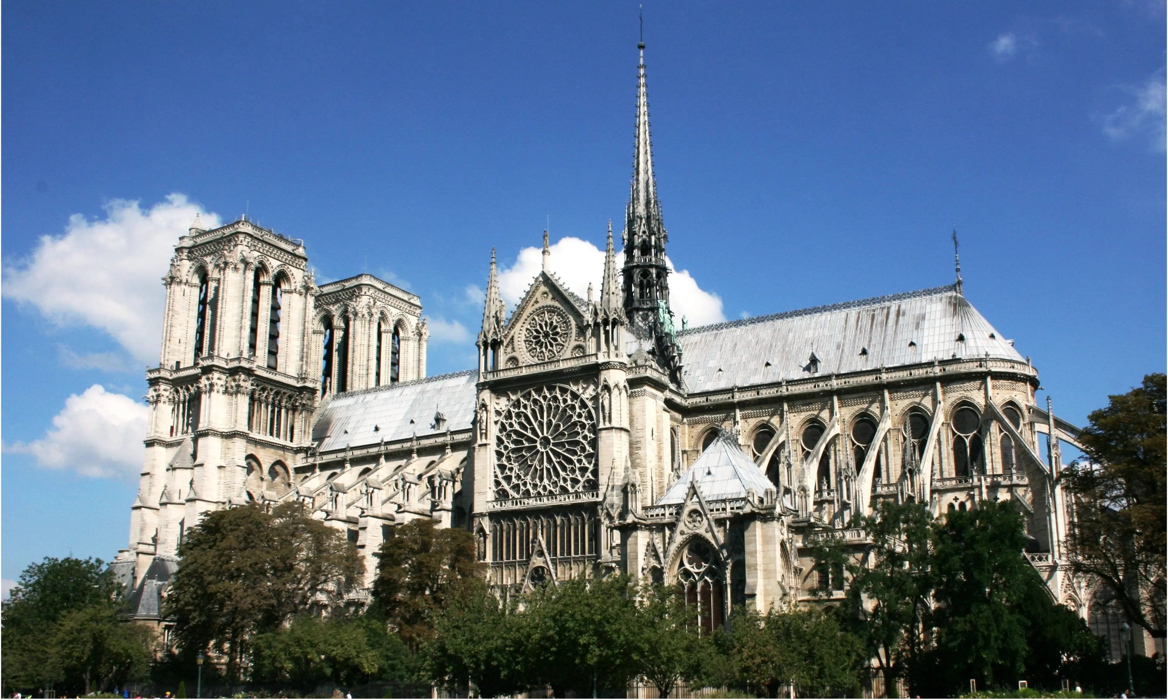 A stunning photograph of Notre Dame Cathedral viewed from the Seine River
